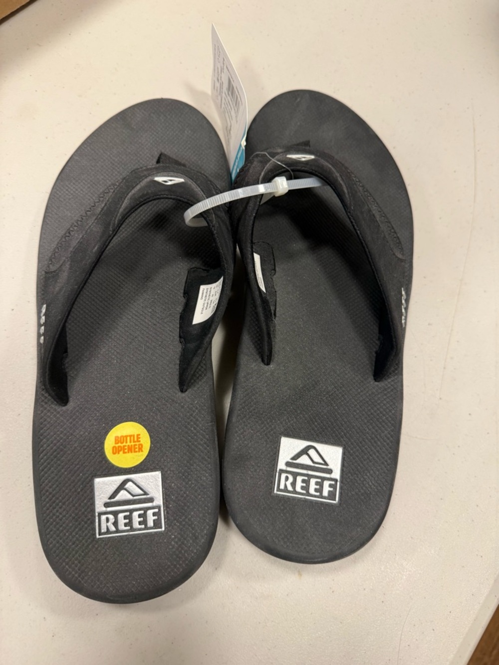 Reef Men’s Black Flip Flops with Logo